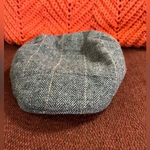 Source unknown on brand, skid lid, 90% polyester 10% wool , very nice